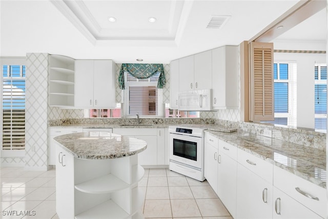 kitchen with light tile patterned floors, a sink, white appliances, and open shelves
