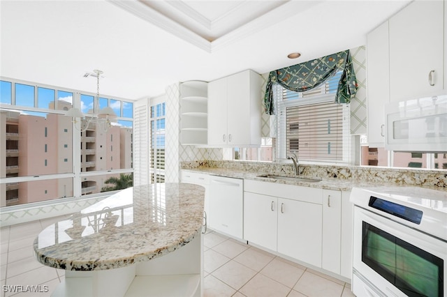 kitchen with a sink, open shelves, tasteful backsplash, white appliances, and a raised ceiling