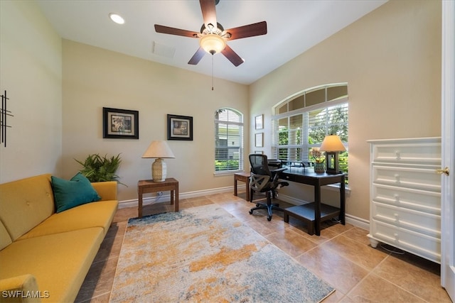 office space with ceiling fan and light tile patterned flooring