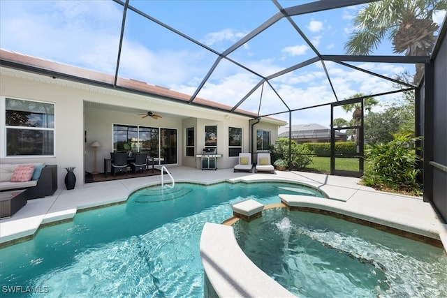 view of pool with an in ground hot tub, outdoor lounge area, ceiling fan, glass enclosure, and a patio