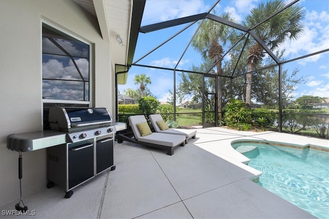 view of pool with a grill, a patio area, and a lanai