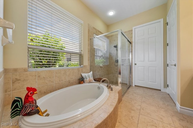 bathroom featuring tile patterned floors and plus walk in shower