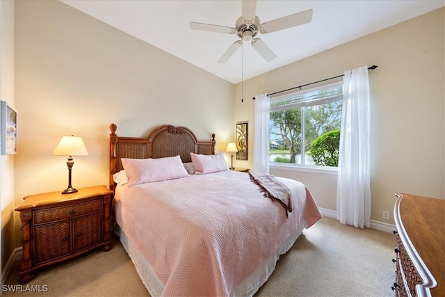 bedroom with ceiling fan and light colored carpet