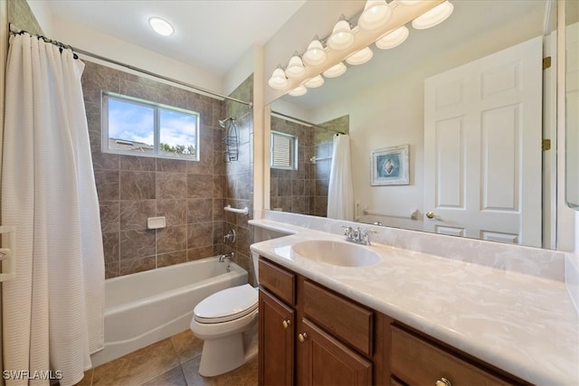 full bathroom featuring tile patterned floors, vanity, shower / bath combination with curtain, and toilet