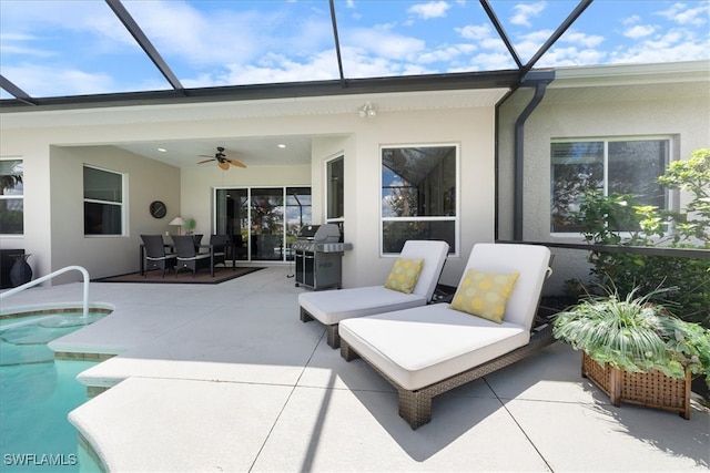 view of patio / terrace with glass enclosure, ceiling fan, and a grill