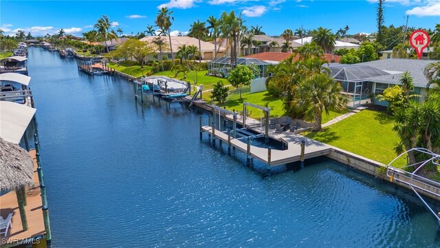 birds eye view of property with a water view