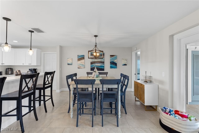 dining area featuring light tile patterned floors