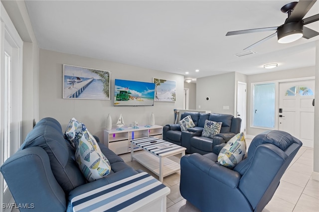 tiled living room featuring ceiling fan