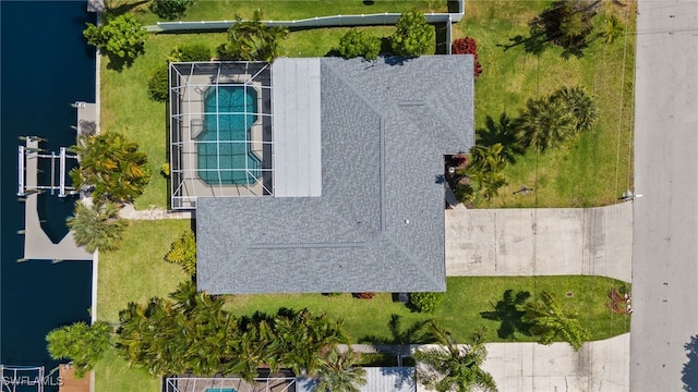 birds eye view of property with a water view