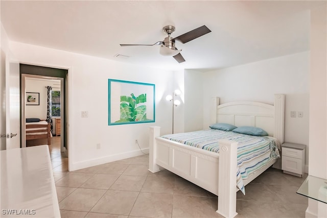 bedroom with light tile patterned floors and ceiling fan