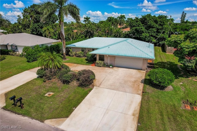 ranch-style home with a front yard and a garage