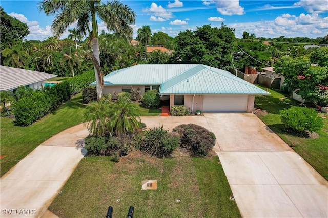 view of front facade featuring a garage and a front lawn