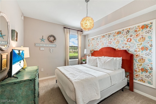 bedroom featuring an inviting chandelier and carpet flooring