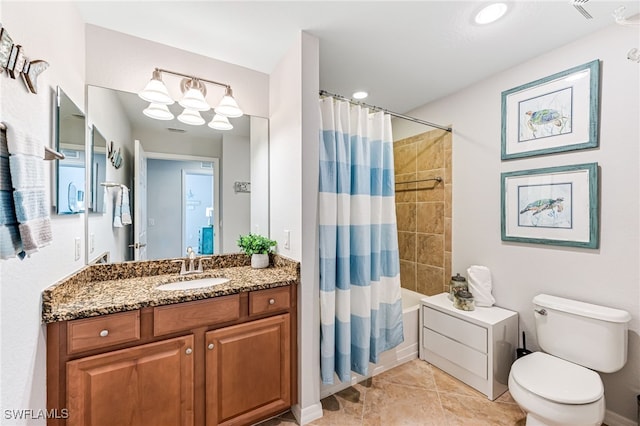 full bathroom featuring shower / bath combination with curtain, vanity, toilet, and tile patterned floors