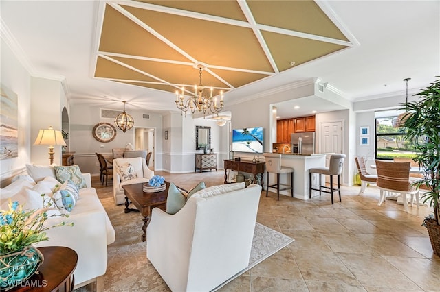 living room featuring crown molding and an inviting chandelier