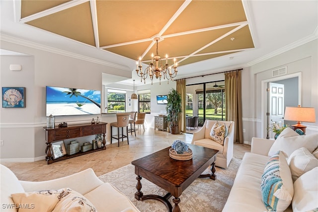 living room featuring ornamental molding and a notable chandelier