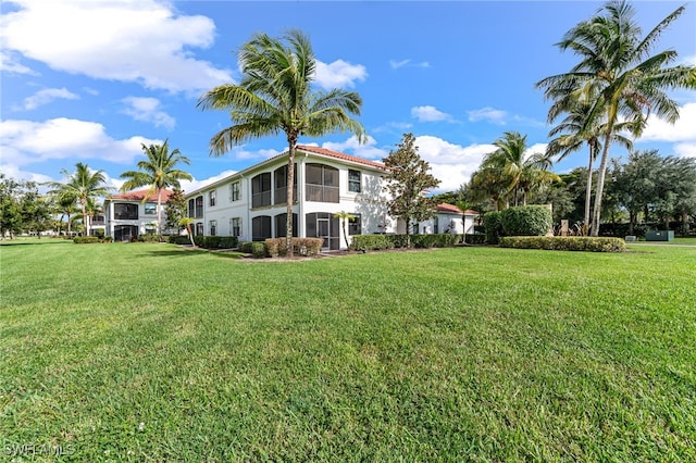 view of yard with a sunroom