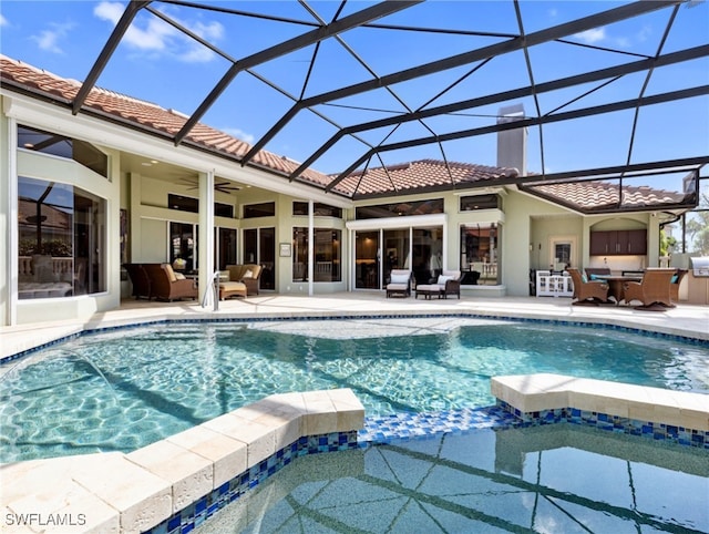 view of pool with ceiling fan, an outdoor living space, glass enclosure, and a patio