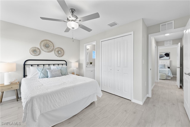 bedroom with ceiling fan, a closet, light wood-type flooring, and ensuite bathroom