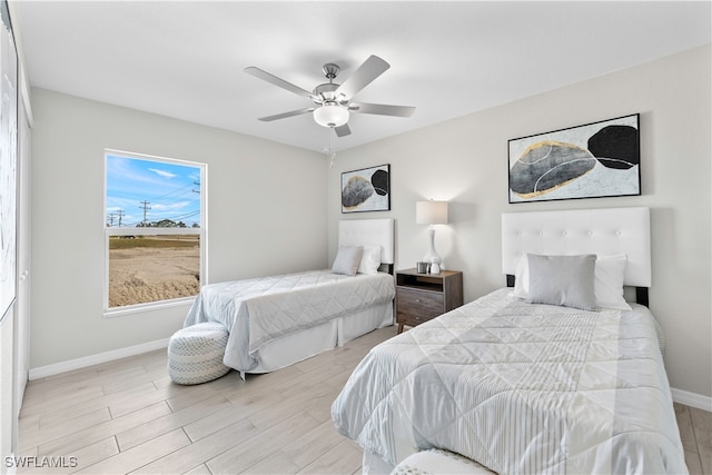 bedroom featuring ceiling fan and light wood-type flooring