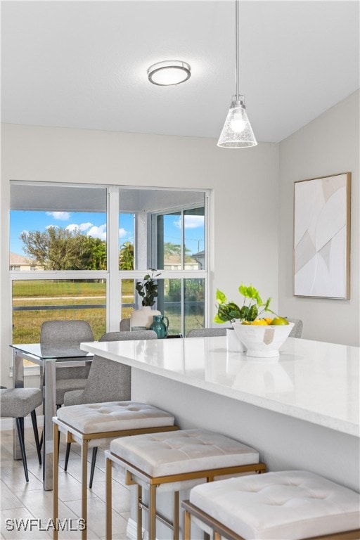 dining area with light tile patterned floors