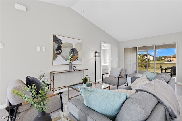 living room featuring lofted ceiling and hardwood / wood-style flooring