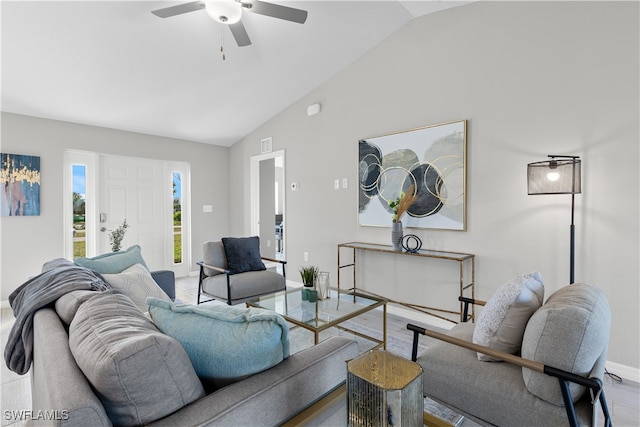 living room with wood-type flooring, vaulted ceiling, and ceiling fan