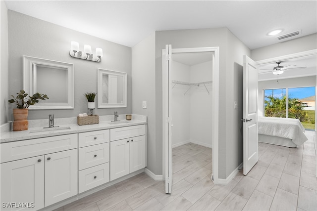 bathroom featuring vanity and ceiling fan