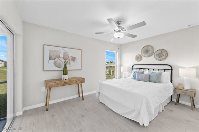 bedroom featuring light hardwood / wood-style floors and ceiling fan