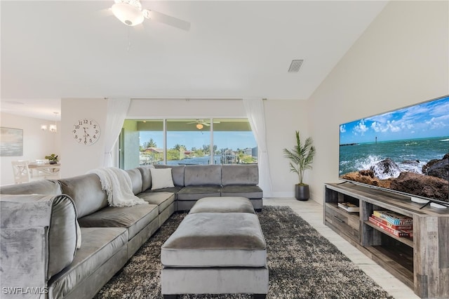 living room with light hardwood / wood-style floors and vaulted ceiling