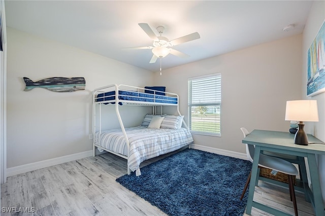 bedroom with ceiling fan and hardwood / wood-style flooring