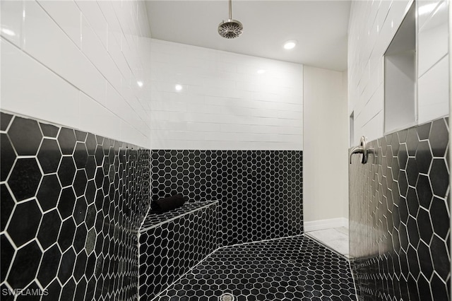 bathroom with tiled shower