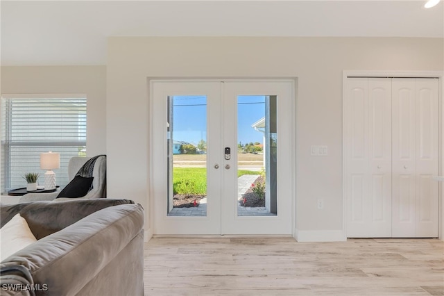 entryway featuring french doors and light hardwood / wood-style floors