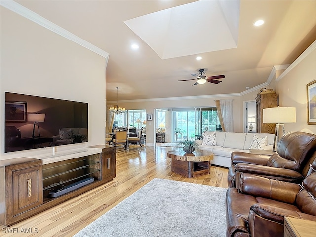 living room with ceiling fan with notable chandelier, light wood-type flooring, and ornamental molding