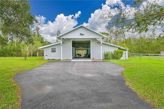 view of front of property with a front yard and a carport