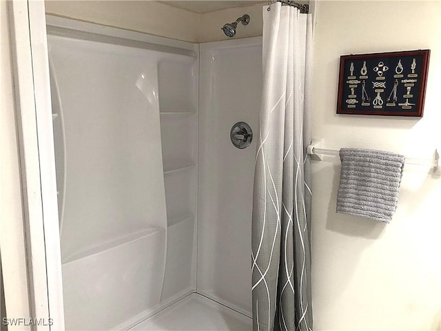 bathroom with a shower with shower curtain