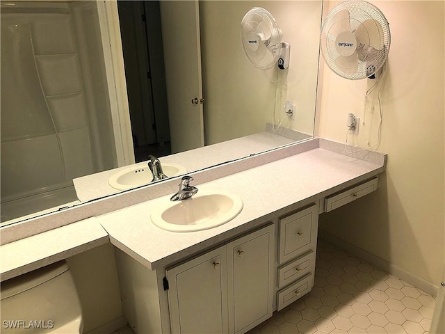 bathroom featuring tile patterned flooring and vanity