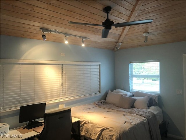 bedroom with ceiling fan, wood ceiling, and vaulted ceiling