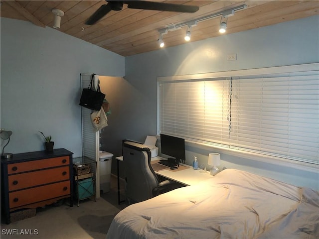 bedroom with track lighting, dark carpet, ceiling fan, and wood ceiling