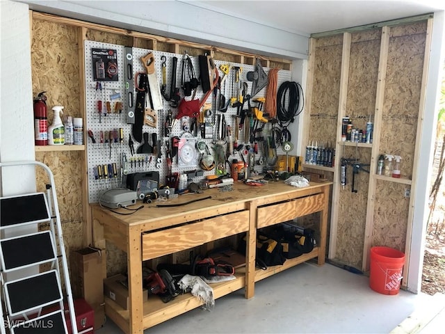 interior space featuring a workshop area and concrete floors