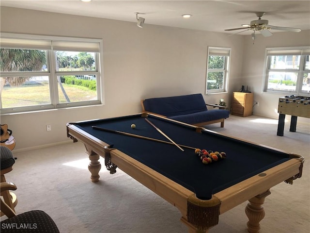 rec room featuring light carpet, ceiling fan, and billiards