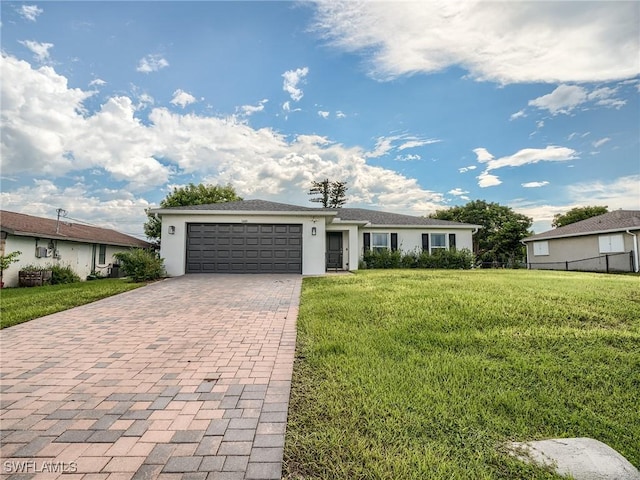 single story home with a front yard and a garage