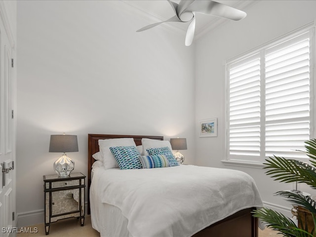 bedroom featuring crown molding and ceiling fan