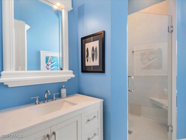 bathroom with vanity, tile patterned flooring, and an enclosed shower