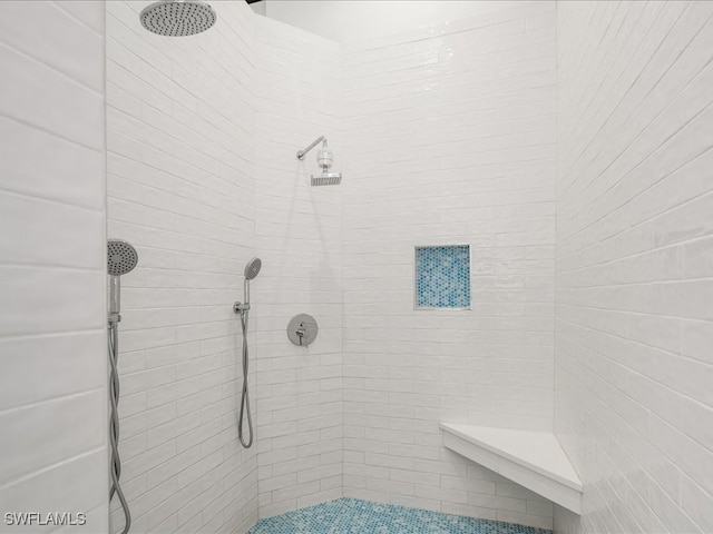 bathroom featuring tiled shower