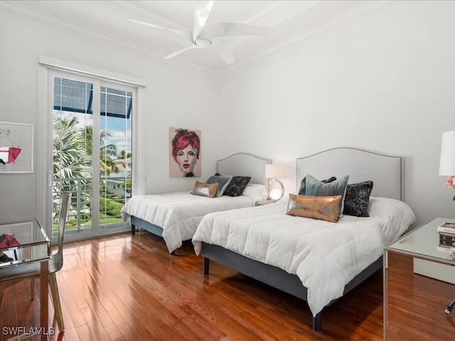 bedroom with hardwood / wood-style floors, access to exterior, multiple windows, and ceiling fan