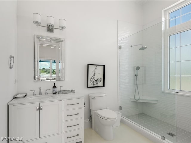 bathroom with vanity, a shower with shower door, and toilet