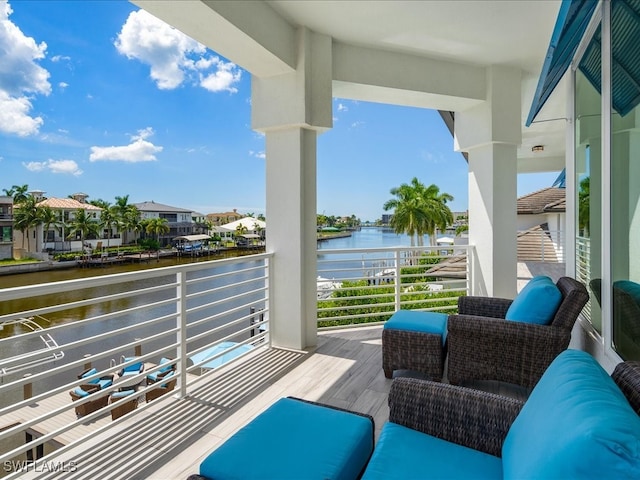 balcony featuring a water view