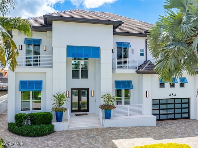 exterior space featuring french doors and a garage