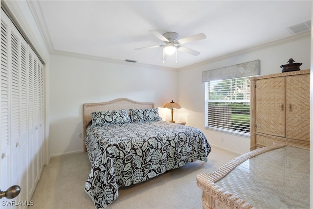 bedroom featuring light carpet, a closet, crown molding, and ceiling fan